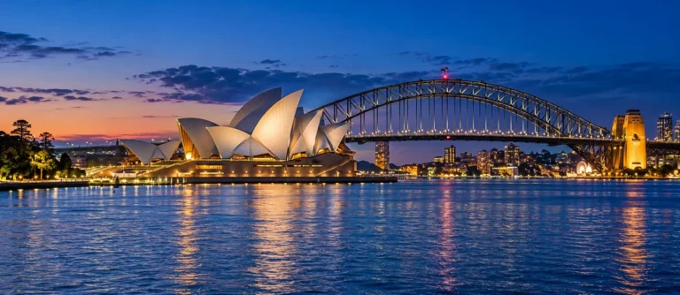 View of the Sydney Opera House and Sydney Harbour Bridge at dusk