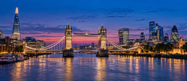 View of Tower Bridge and the London skyline at dusk